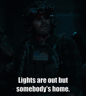 A Man In A Helmet With The Words Lights Are Out But Somebody 'S Home GIF