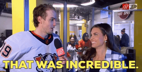 A Man In A Hockey Jersey Is Being Interviewed By A Woman With The Words That Was Incredible GIF