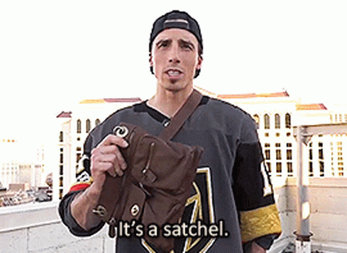 A Man In A Hockey Jersey Is Holding A Bag And Says It 'S A Satchel GIF