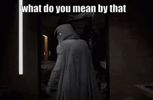A Man In A Hooded Cape Is Standing In Front Of A Mirror With The Words `` What Do You Mean By That '' . GIF