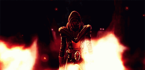 A Man In A Hooded Jacket Is Surrounded By Flames And Smoke GIF