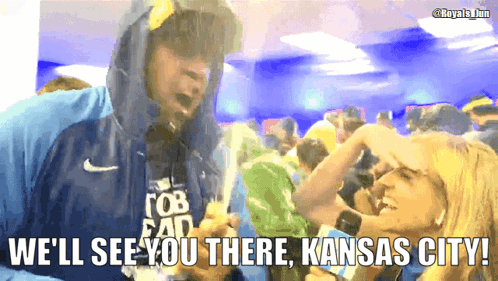 A Man In A Hooded Jacket Says We 'Ll See You There Kansas City In Front Of A Crowd Of People GIF