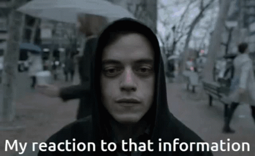 A Man In A Hooded Jacket With The Words My Reaction To That Information Below Him GIF
