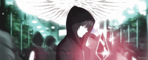 A Man In A Hooded Jacket With Wings Holds A Crystal GIF