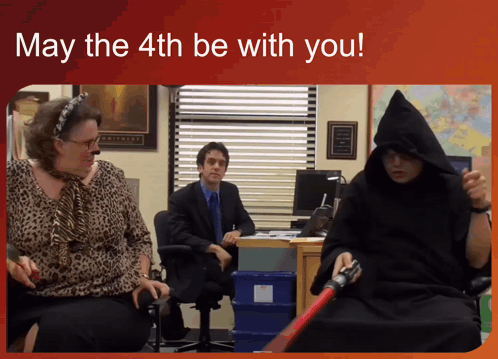 A Man In A Hooded Robe Is Holding A Darth Vader Lightsaber GIF