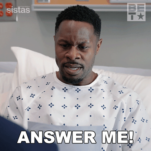 A Man In A Hospital Gown Is Asking To Answer Him GIF
