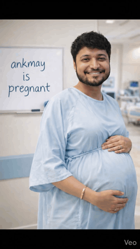 A Man In A Hospital Gown Is Pregnant GIF