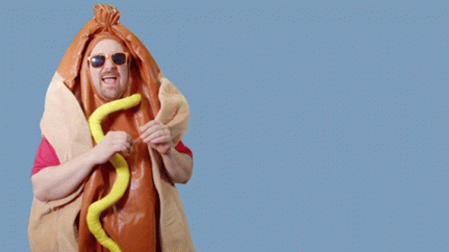 A Man In A Hot Dog Costume Says Cash Mon-Ay On A Blue Background GIF