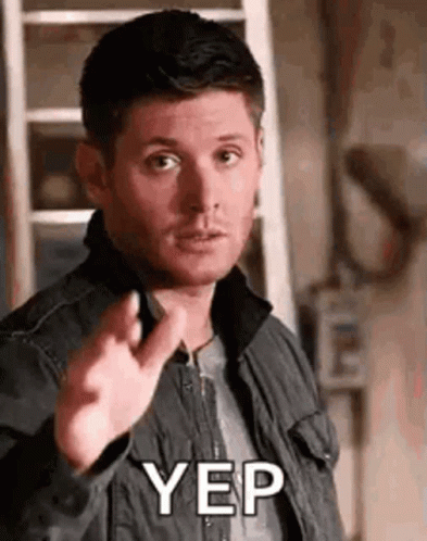 A Man In A Jacket Is Pointing His Finger At The Camera And Saying Yep . GIF