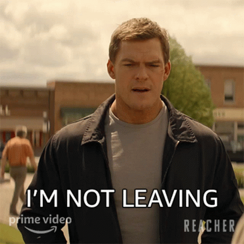 A Man In A Jacket Says " I 'M Not Leaving " On A Screen GIF