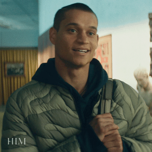 A Man In A Jacket With The Word Him On The Bottom GIF