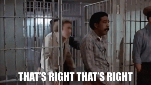 A Man In A Jail Cell With The Words `` That 'S Right That 'S Right '' Written On It . GIF