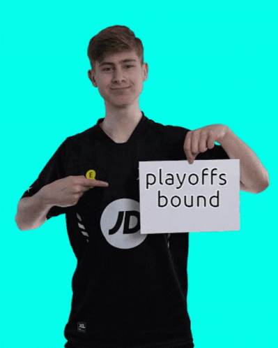 A Man In A Jd Shirt Holds Up A Sign That Says Playoffs Bound GIF