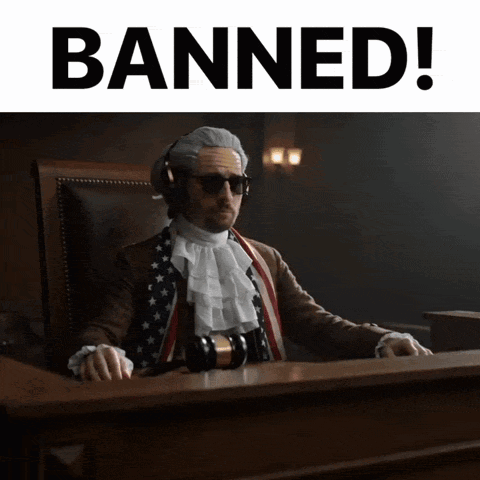 A Man In A Judge 'S Chair With The Words Banned Behind Him GIF