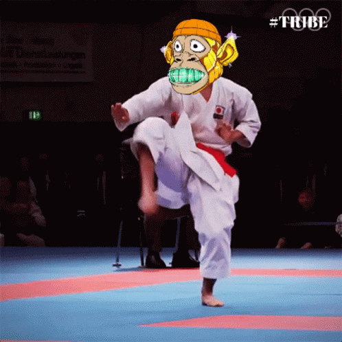 A Man In A Karate Uniform With A Monkey Mask On His Face GIF