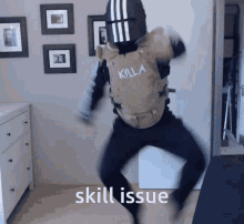 A Man In A Killa Vest Is Jumping In The Air GIF