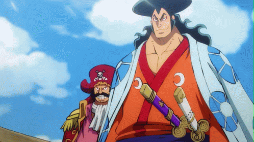 A Man In A Kimono Is Holding A Purple Sword With The Letter C On It GIF