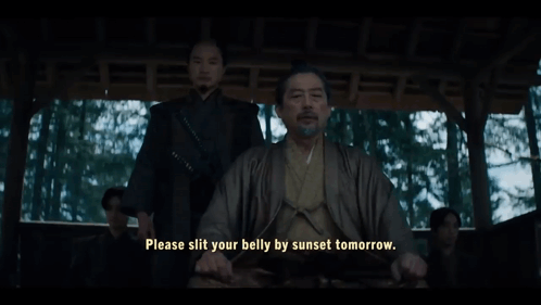 A Man In A Kimono Is Sitting In A Chair With The Words Please Slit Your Belly By Sunset Tomorrow GIF