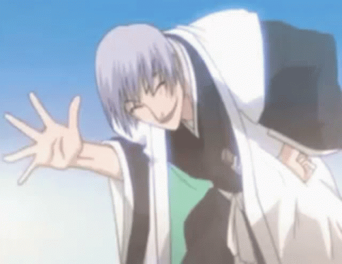 A Man In A Kimono Is Waving His Hand In The Air . GIF