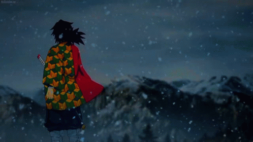 A Man In A Kimono Stands In The Snow With A Sword In His Hand GIF