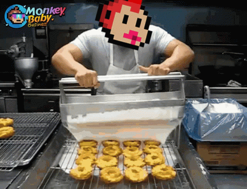 A Man In A Kitchen With A Monkey Baby Business Logo Above Him GIF