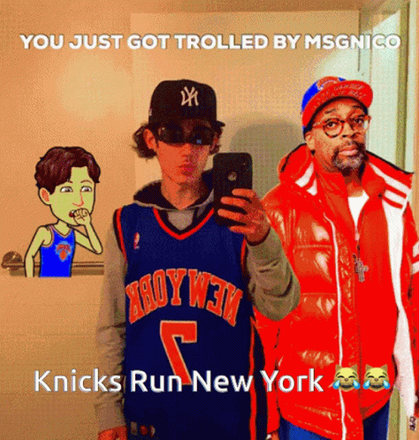 A Man In A Knicks Jersey Takes A Selfie With A Man In An Orange Jacket GIF