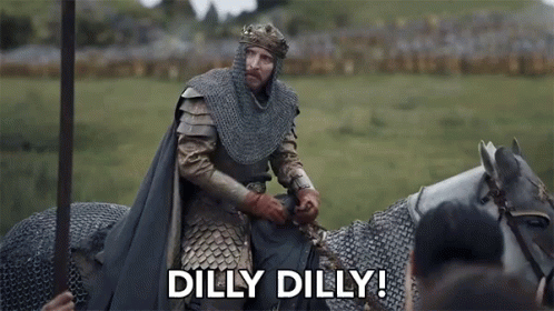 A Man In A Knight 'S Armor Is Riding A Horse And Saying `` Dilly Dilly '' . GIF