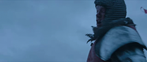 A Man In A Knight 'S Armor Is Screaming With His Mouth Open GIF