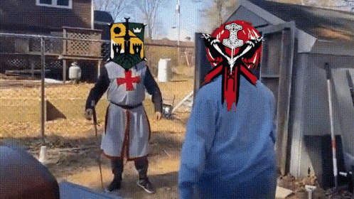 A Man In A Knight 'S Armor With A Cross On His Head GIF