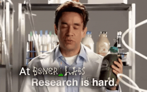 A Man In A Lab Coat Is Holding A Bottle Of Green Juice In Front Of A Sign That Says At Boner Labs GIF