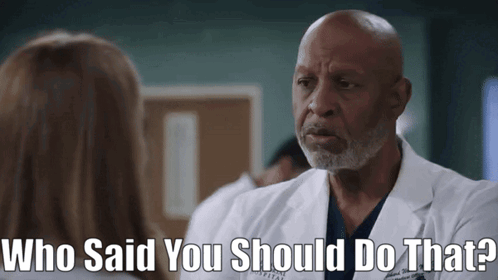 A Man In A Lab Coat Is Talking To A Woman And The Words Who Said You Should Do That Are Above Him GIF