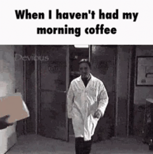 Lab Coat Man Walking Down Hallway With Box GIF