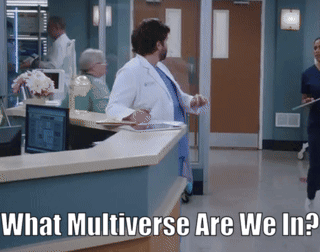 A Man In A Lab Coat Stands At A Counter In A Hospital With The Words " What Multiverse Are We In " Below Him GIF