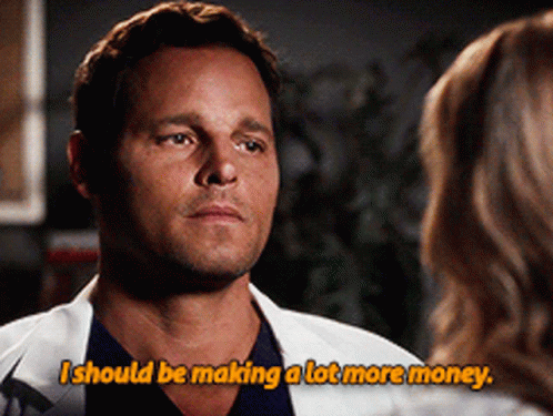 A Man In A Lab Coat Talks To A Woman And Says I Should Be Making A Lot More Money GIF