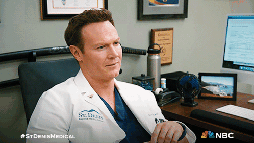 A Man In A Lab Coat That Says St Denis Medical GIF