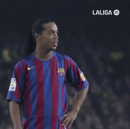A Man In A Laliga Shirt Is Pointing At Something GIF