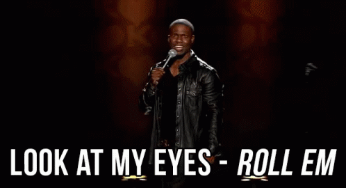 A Man In A Leather Jacket Is Holding A Microphone And Saying `` Look At My Eyes Roll Em '' . GIF