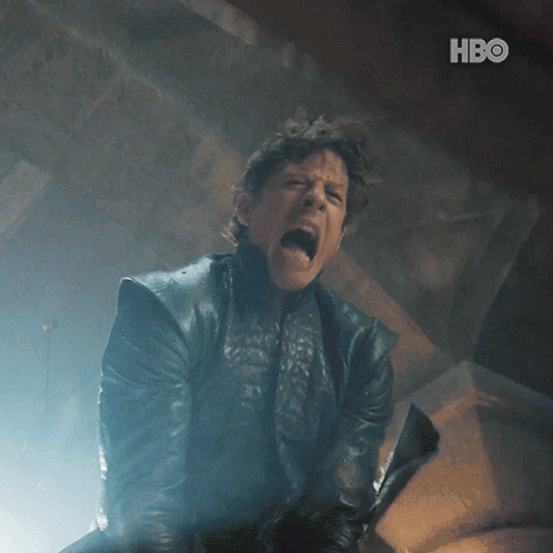 A Man In A Leather Jacket Is Screaming And Holding A Sword With The Hbo Logo In The Background GIF