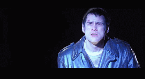 A Man In A Leather Jacket Is Singing The Song Come Again GIF