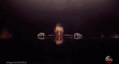 A Man In A Leather Jacket Is Sitting At A Table With The Abc Logo On The Bottom GIF
