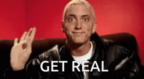 A Man In A Leather Jacket Is Sitting On A Couch With The Words Get Real Written On The Bottom Of His Face . GIF
