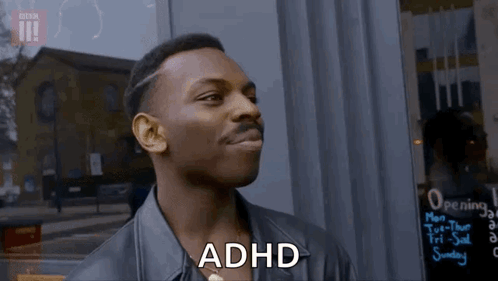 A Man In A Leather Jacket Is Smiling And Says Adhd GIF