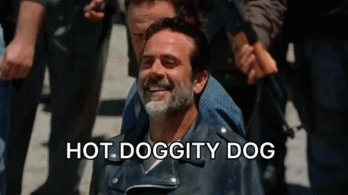 A Man In A Leather Jacket Is Smiling With The Words Hot Doggity Dog Written Below Him GIF