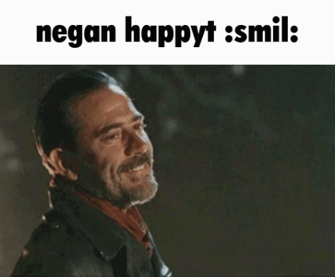 A Man In A Leather Jacket Is Smiling With The Words Negan Happyt Smil GIF