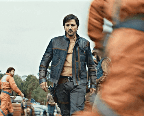 Man In Leather Jacket In Crowd Of People GIF
