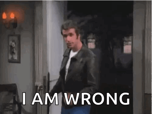 A Man In A Leather Jacket Is Standing In A Doorway With The Words `` I Am Wrong '' . GIF
