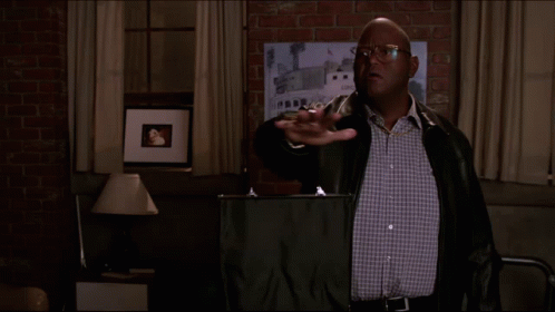 A Man In A Leather Jacket Stands In Front Of A Sign That Says Blessings On It GIF