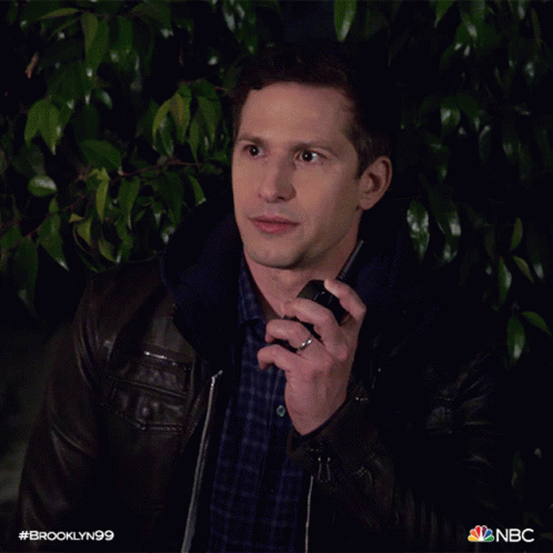 Man In Leather Jacket Talking On Cell Phone GIF