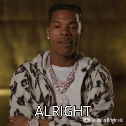 A Man In A Leopard Print Jacket Is Making A Funny Face And Says Alright GIF