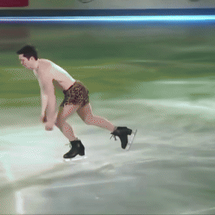 A Man In A Leopard Print Shorts Is Ice Skating GIF